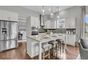 Modern kitchen features granite countertops, stainless steel appliances, and a center island with seating at 1472 Longspur Dr, Mount Pleasant, SC 29466