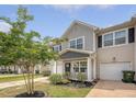 Charming two-story home with gray siding, well-manicured lawn, and an attached one car garage at 152 Kirkland St, Goose Creek, SC 29445