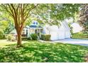 Beautiful two-story home with a three-car garage and a lush green lawn at 1541 Diamond Blvd, Mount Pleasant, SC 29466
