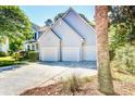 Two-story house featuring three-car garage with driveway and landscaped yard at 1541 Diamond Blvd, Mount Pleasant, SC 29466