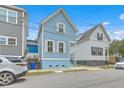 Charming blue two-story home with well-maintained landscaping and a cozy front porch at 169 Jackson St, Charleston, SC 29403