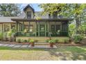 Cozy screened porch with comfortable seating, offering a tranquil space to enjoy the outdoors at 2144 Pinopolis Rd, Pinopolis, SC 29469