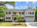 Charming two-story home featuring a well-maintained lawn and traditional architectural details at 2159 Parkway Dr, Charleston, SC 29412