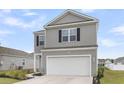 Two-story home boasts grey siding, black shutters, a two-car garage, and a well-maintained lawn at 244 Wild Strawberry Ln, Moncks Corner, SC 29461