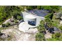 Aerial view of a concrete building surrounded by lush greenery at 3030 Brownell, Sullivans Island, SC 29482
