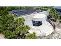 Aerial view of a unique building with concrete and lush greenery at 3030 Brownell, Sullivans Island, SC 29482