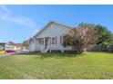 Charming single-story home featuring a cozy front porch, attached garage, and well-maintained lawn at 3050 Brigham Ct, North Charleston, SC 29406