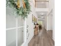 Welcoming foyer with a long hallway, hardwood floors and stylish decor at 307 Theus Pl, Huger, SC 29450