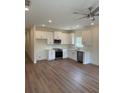 Bright kitchen features stainless appliances, white cabinetry, and hardwood flooring at 3214 Pinewood Dr, Ladson, SC 29456