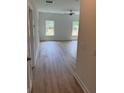 Bright living room with lots of light, ceiling fan, and gorgeous wood-look flooring at 3222 Pinewood Dr, Ladson, SC 29456