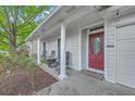 Inviting front porch with cozy seating and decorative details around the entrance at 3230 Landing Pkwy, North Charleston, SC 29420