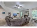 Spacious living room featuring a stone fireplace, vaulted ceiling, and comfortable seating at 3230 Landing Pkwy, North Charleston, SC 29420