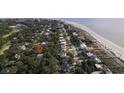 Beautiful aerial view highlighting the property's close proximity to the beach and surrounding neighborhood at 3320 Myrtle St, Edisto Island, SC 29438