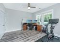Bright home office with wood-look floors, a ceiling fan, and natural light from large windows at 3941 Bessemer Rd, Mount Pleasant, SC 29466