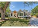 Elegant home with a well-manicured lawn, stylish windows, and a welcoming front entrance at 422 Palm St, Mount Pleasant, SC 29464