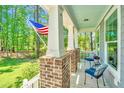 Charming front porch with brick supports and comfortable seating at 474 Woodspring Rd, Mount Pleasant, SC 29466