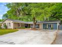 Expansive front yard with a circular driveway leading to a charming single story home at 5 S Basilica Ave, Hanahan, SC 29410