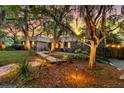 Beautiful brick home with well-manicured landscaping and a stone walkway leading to the entrance at 521 Pelzer Dr, Mount Pleasant, SC 29464