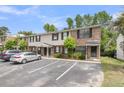 Attractive brick townhome with black shutters, parking, and a welcoming front entrance at 6260 Brandt St # 4-D, North Charleston, SC 29406