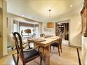 Inviting dining room with a rustic wooden table, stylish chairs, and a cozy window nook perfect for entertaining at 717 Chatter Rd, Mount Pleasant, SC 29464