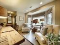 Comfortable sitting area featuring plush chairs by a bay window creating a relaxing retreat within the dining room at 717 Chatter Rd, Mount Pleasant, SC 29464