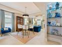 Stylish dining area flowing into a sophisticated living space with plush seating and elegant decor at 8 Prioleau St # Th A, Charleston, SC 29401