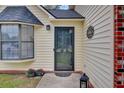 Close-up of the front door, showing its decorative details and inviting entryway at 1019 Tj Ln, Summerville, SC 29486