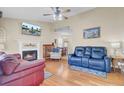 Inviting living room with a fireplace, ceiling fan, and hardwood floors at 1019 Tj Ln, Summerville, SC 29486