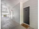 View of a hallway featuring an exterior door with welcome mat to the right at 1300 Park West Blvd # 811, Mount Pleasant, SC 29466