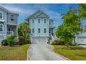 Inviting two-story home with a garage and well-maintained lawn at 133 Alder Cir, Charleston, SC 29412