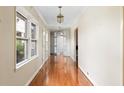 An inviting foyer featuring gleaming hardwood floors and elegant lighting fixtures at 1405 S Edgewater Dr, Charleston, SC 29407