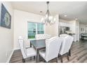 Cozy dining area with wood-look flooring, elegant furnishings, and an abundance of natural light at 141 Clydesdale Cir, Summerville, SC 29486