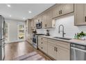 Well-lit kitchen boasts stainless appliances, white countertops, and ample cabinet space at 1541 Hutton Pl, Charleston, SC 29407