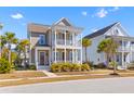 Charming two-story home with double porches and well-maintained landscaping at 1580 Cranes Nest Rd, Mount Pleasant, SC 29466