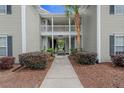 Close-up of a walkway leading to condos showcasing a well-maintained landscape at 1606 Whitby Ln, Charleston, SC 29414