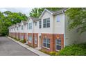 Charming townhomes featuring a brick and vinyl exterior in a well-maintained community at 241 Howle Ave # H, Charleston, SC 29412