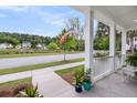 Picturesque front porch view overlooking a serene pond and well-maintained neighborhood at 2729 Battery Pringle Dr, Johns Island, SC 29455