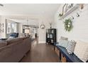 Open-concept living room showing hardwood floors and seamlessly connects to the dining area at 308 Watergrass St, Summerville, SC 29486