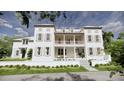 Charming home with a welcoming front porch and lush landscaping, capturing a serene and inviting curb appeal at 33 Duany Rd, Mount Pleasant, SC 29464