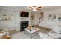 Inviting living room features a fireplace, modern decor, and wood-look flooring at 333 O'Leary Circle, Summerville, SC 29483