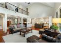 Spacious open concept living area with high ceilings, hardwood floors, and seamless flow to the kitchen at 3924 Regal Oak Ln, Johns Island, SC 29455