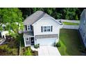 Stylish two-story home with well-maintained lawn, a two-car garage, and a welcoming entrance at 3952 Treebranch Cir Cir, Mount Pleasant, SC 29429