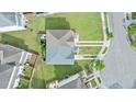 An aerial view shows the roof and backyard space of the property, and surrounding neighborhood at 4209 Climbing Tree Ct, Charleston, SC 29414