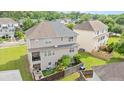This aerial shot shows the property's fenced yard, private balcony, and wooded surroundings at 4209 Climbing Tree Ct, Charleston, SC 29414