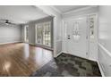Elegant foyer featuring slate tile flooring, crown molding, and decorative front door with sidelights at 4343 Helene Dr, North Charleston, SC 29418