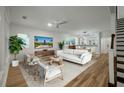 Bright and airy living room with modern furniture, wood floors, and open floorplan at 5514 Colonial Chatsworth Cir, North Charleston, SC 29418