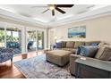 Bright living room with comfortable seating, stylish decor, and access to screened porch at 60 Rice Ln, Edisto Beach, SC 29438