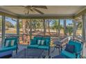 Inviting screened porch featuring comfortable seating and scenic outdoor views at 60 Rice Ln, Edisto Beach, SC 29438