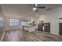 Bright kitchen features stainless appliances, a spacious island and modern pendant lighting at 619 Hilchot Dr, Summerville, SC 29486