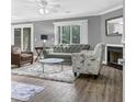 Cozy living room featuring a fireplace, plush rug, and ample natural light from a sliding glass door at 7911 Windfern Ct # 1502, North Charleston, SC 29418